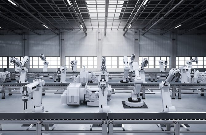 Automated factory floor with industrial robot workstations